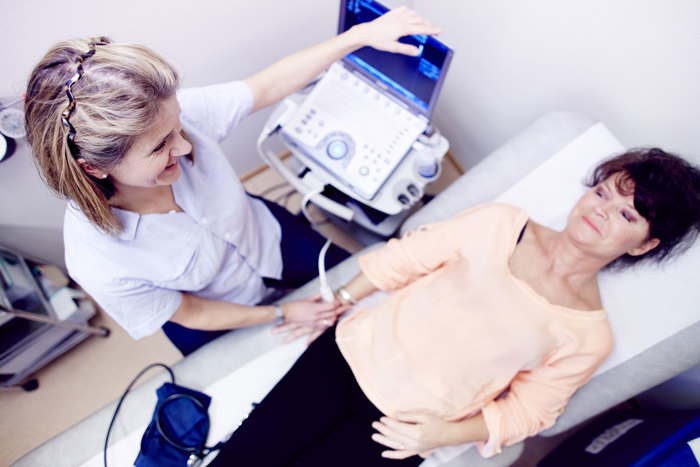 A female doctor treating a woman