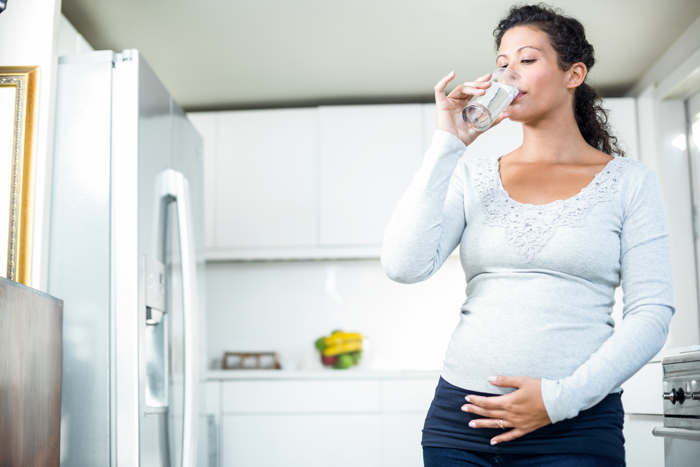 Pregnant woman drinking water