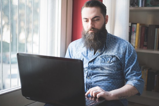 A man submitting a complaint on a computer