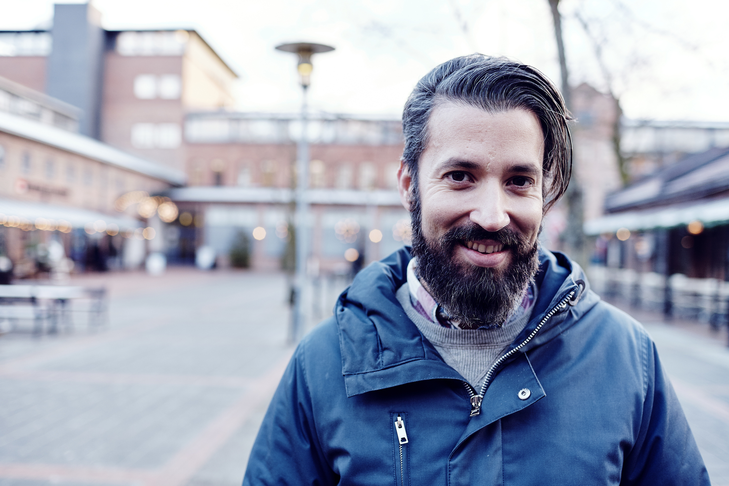 Smiling man at a square