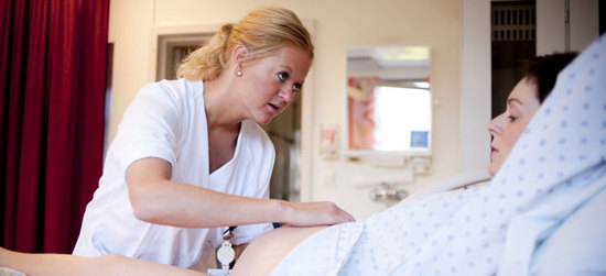 Female doctor examining a pregnant woman