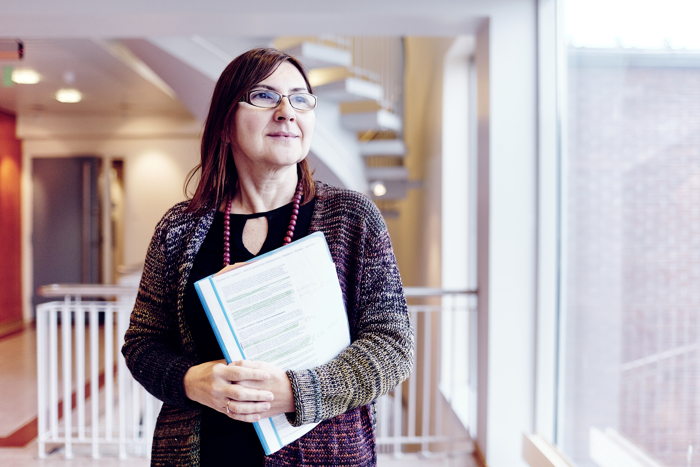 Woman holding papers