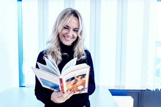 Woman reading a travel guide
