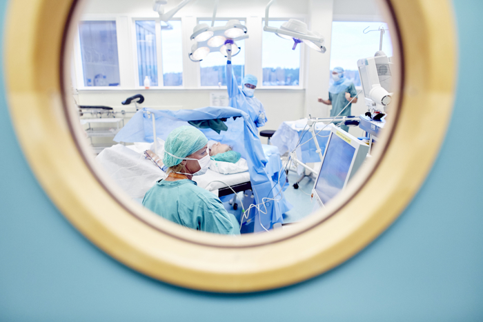 Looking through window at operating room